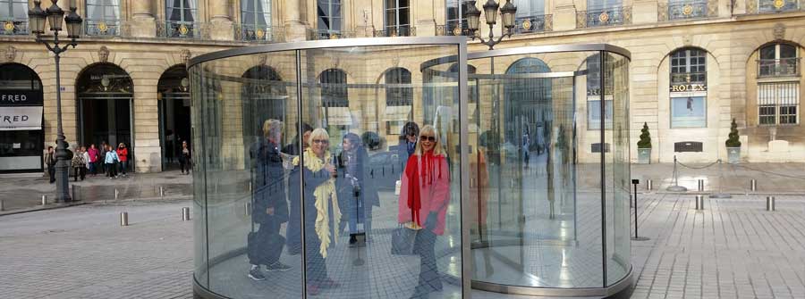 4 of 10, Two women exploring a glass art exhibit in Europe