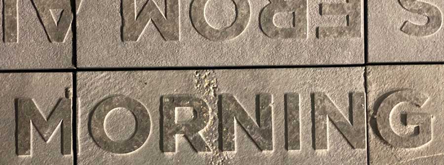 3 of 4, Close up of one of the words in a new walkway with thousands of embossed words